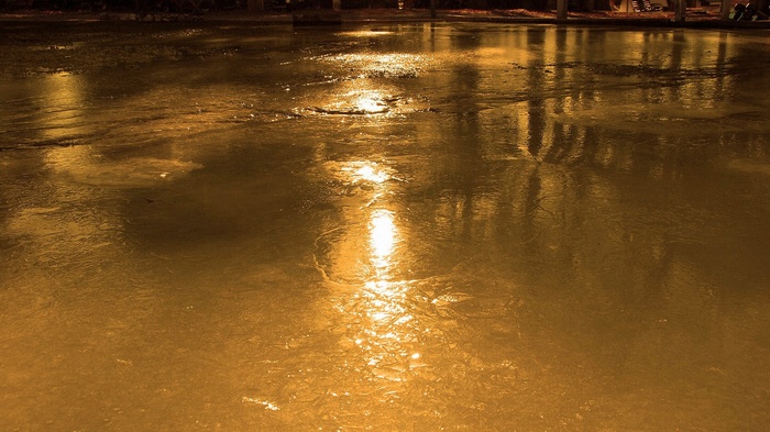 Reflections on a wet surface at night