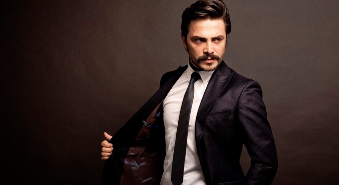 Ahmet Kural in a dark suit and tie
