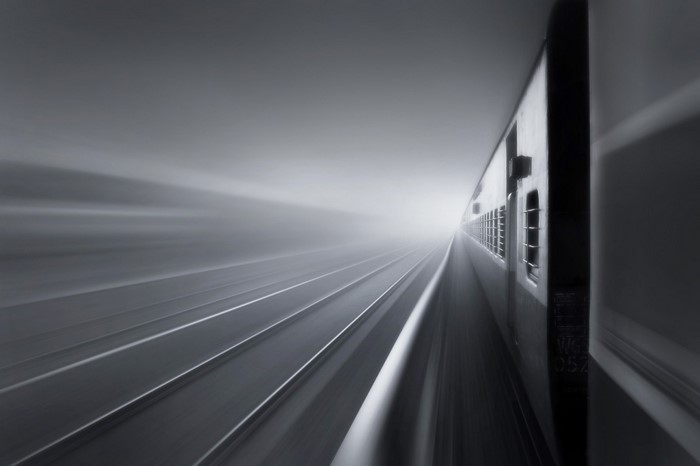Long exposure photography of a train on railway tracks