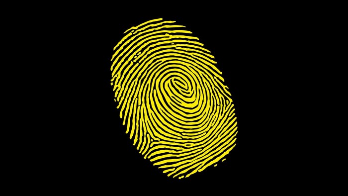 Yellow fingerprint on black background