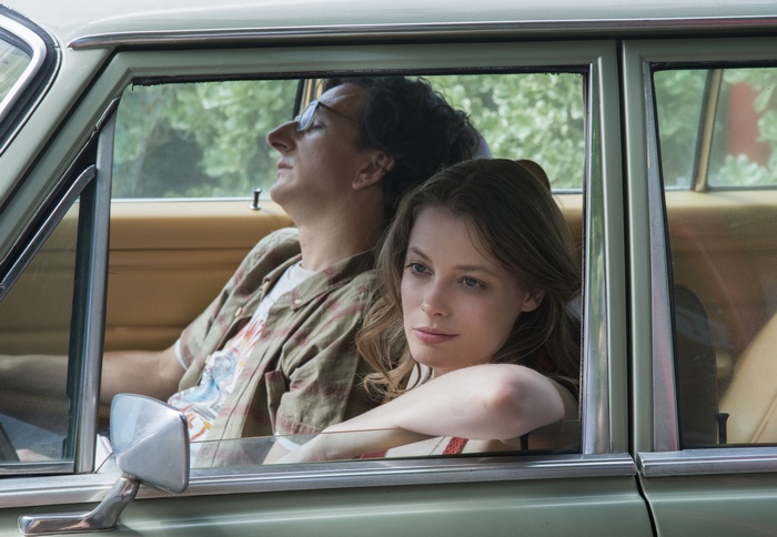 Gillian Jacobs and Paul Rust in a car