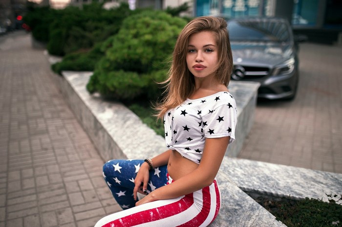 Woman in star print t-shirt and American flag pants