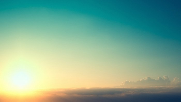 Sunset over clouds with sun and sky