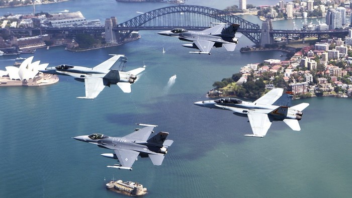 Fighter jets fly over Sydney Harbour with Opera House and Harbour Bridge