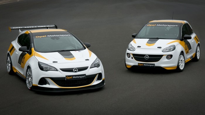 Two Opel Motorsport race cars on a track