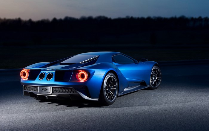 Blue Ford GT sports car at dusk