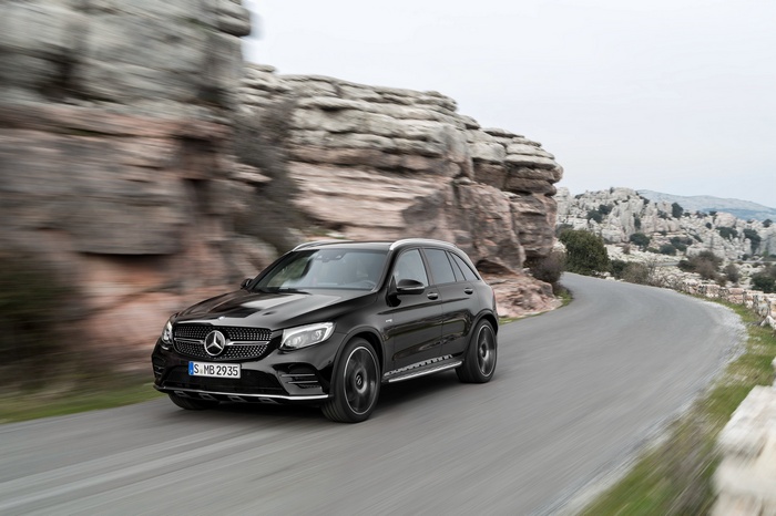 Black Mercedes-AMG GLC 43 4MATIC on a winding road