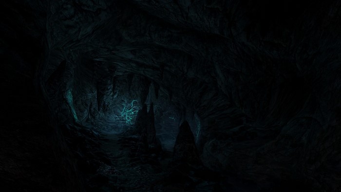 Cave with glowing formations in darkness