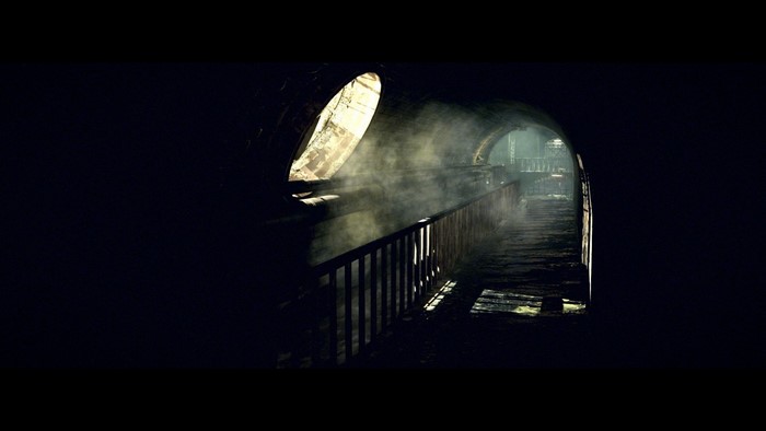 Dark tunnel with light and smoke