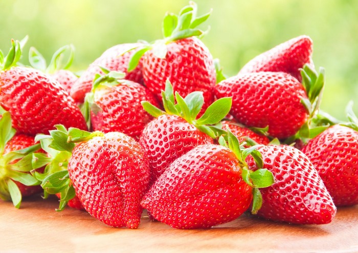Fresh Red Strawberries with Green Leaves