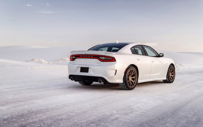 White Dodge Charger SRT Hellcat on a snowy road