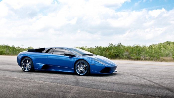Blue Lamborghini sports car on a road