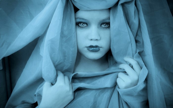 Woman with blue fabric covering her head
