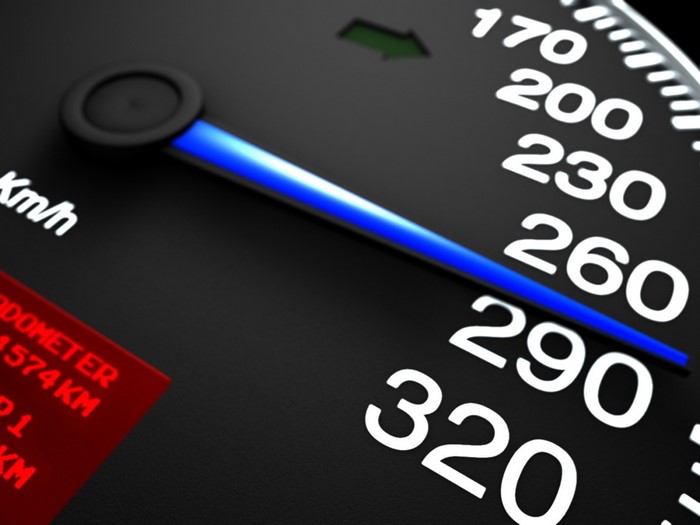 Car speedometer showing speed in km/h