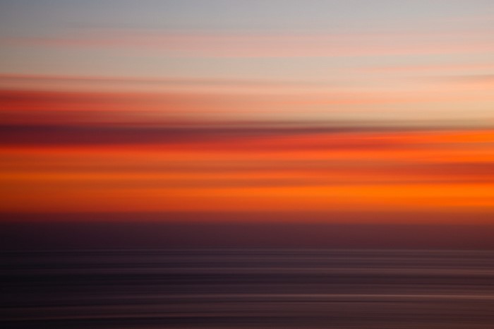 Abstract sunset over the ocean with panning effect