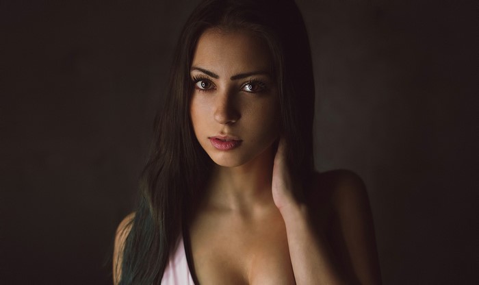 Portrait of a young woman with long dark hair