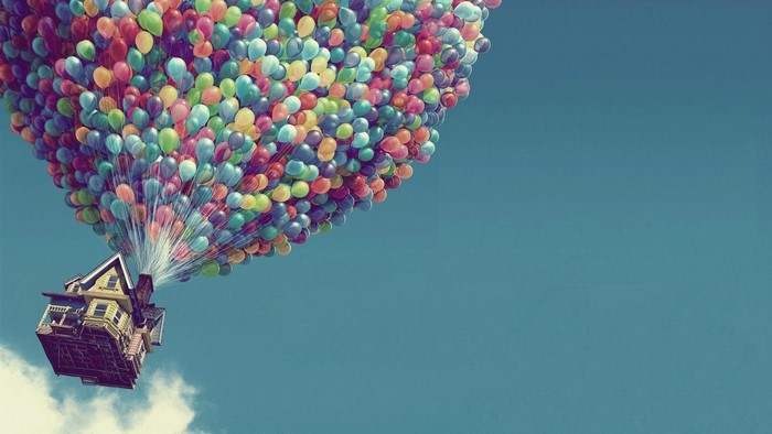House lifted by balloons in the sky