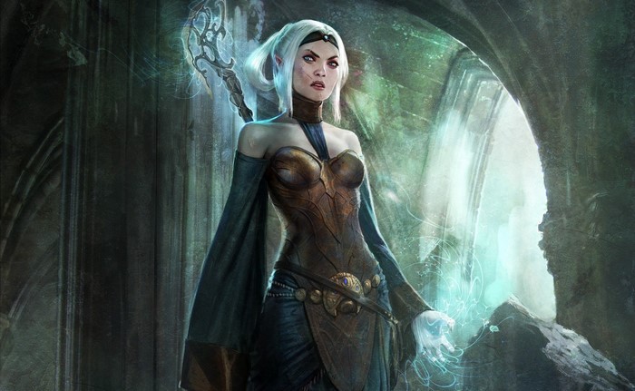 Woman mage with staff in dark ruins