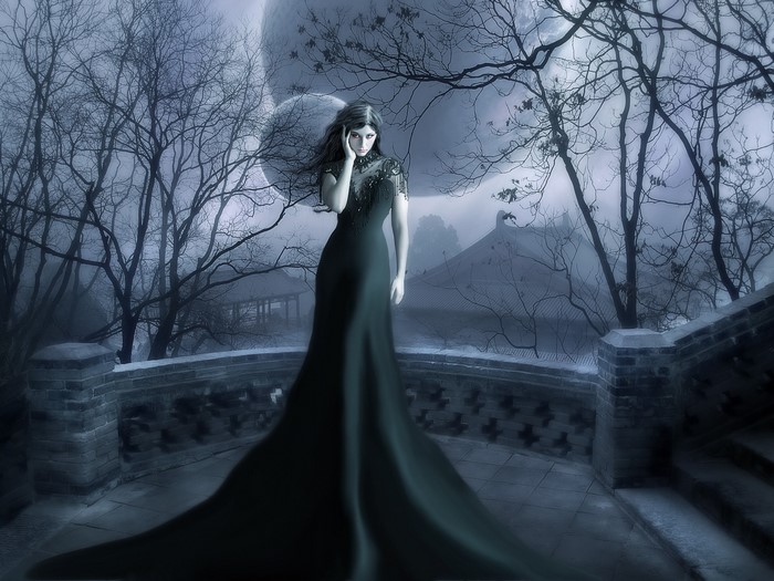 Woman in dark dress on a balcony in winter