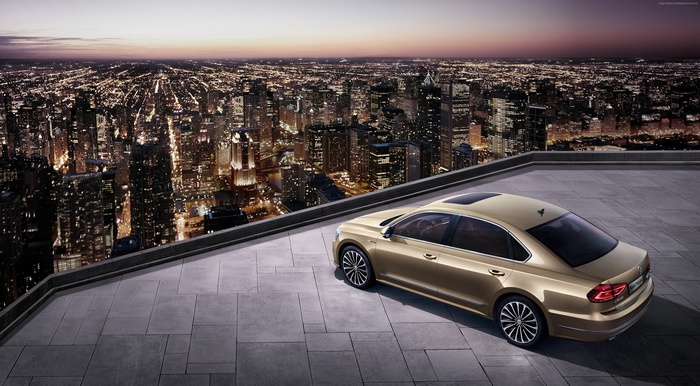 Volkswagen Passat CN-spec sedan on a rooftop overlooking a city at night