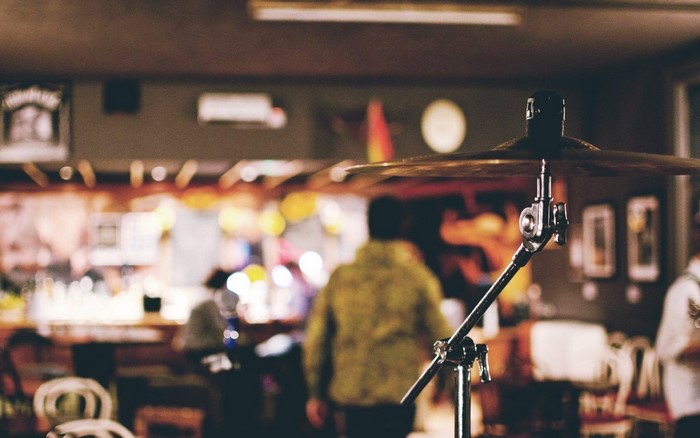 Drum cymbal in a bar with people