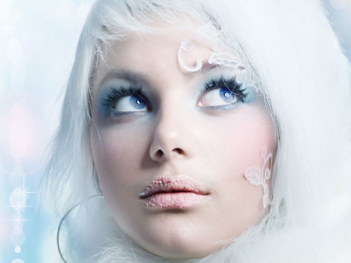 Woman with ice-themed makeup and white hair