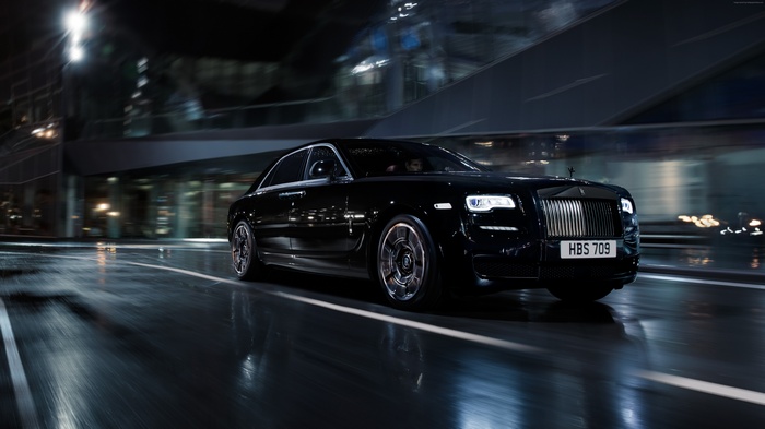 Black Rolls-Royce Wraith "Black Badge" driving at night