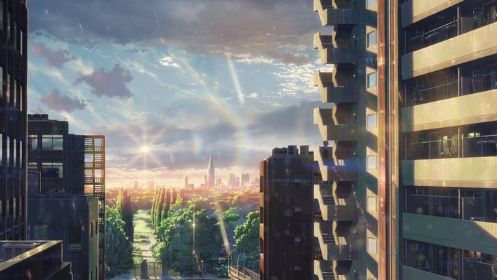Anime cityscape with buildings and a rainbow