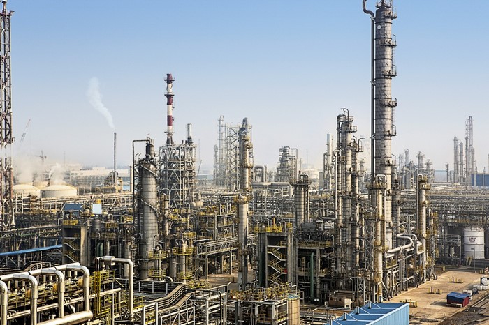 Industrial complex with towers and pipes