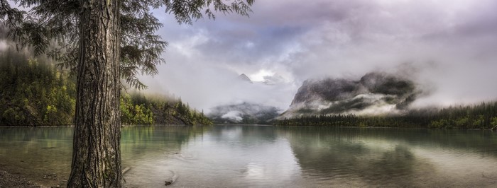 Misty mountains and lake in British Columbia, Canada