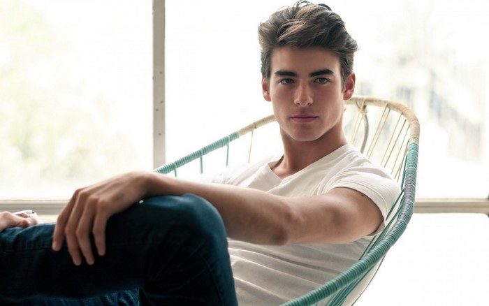 Young man sitting in a chair