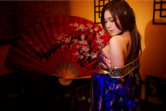Elegant Asian Woman in Traditional Floral Dress