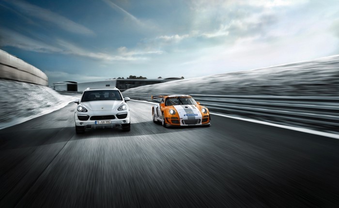 Porsche Cayenne and Porsche 911 GT3 on a Racetrack