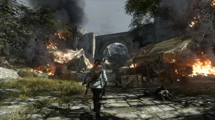Lara Croft from Rise of the Tomb Raider in a burning camp