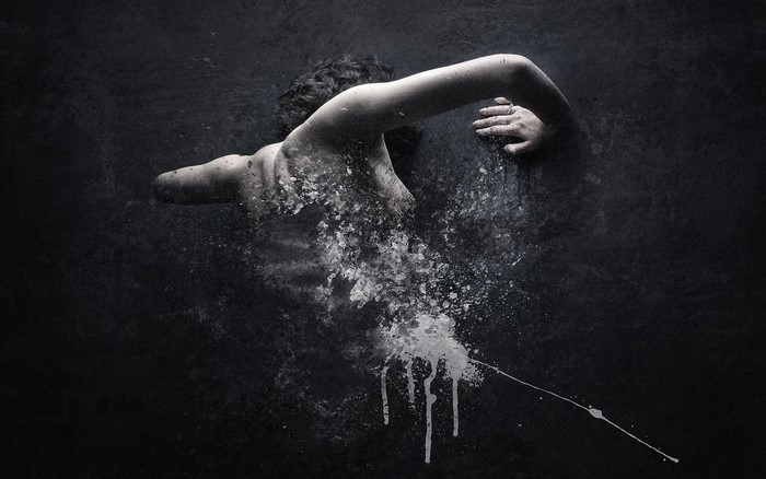 Monochrome artwork of a person dissolving into white paint