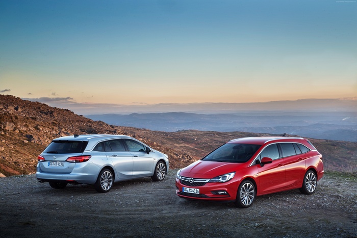 Opel Astra Sports Tourer BiTurbo cars on a mountain road