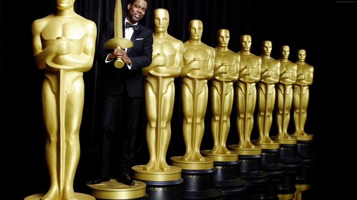 Chris Rock with Oscar Statues