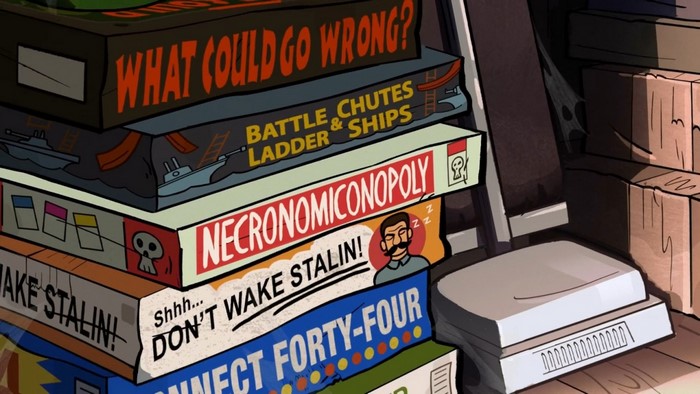Stack of board games including Necronomiconopoly and Don't Wake Stalin!