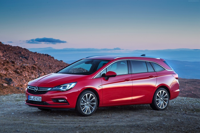 Red Opel Astra Sports Tourer BiTurbo parked on rocky terrain