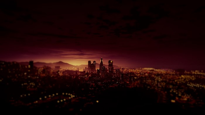 Cityscape at Dusk with Mountains in the Background