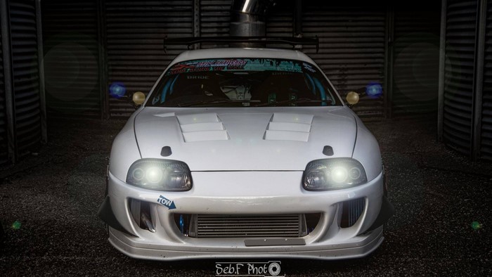 White Toyota Supra with racing modifications