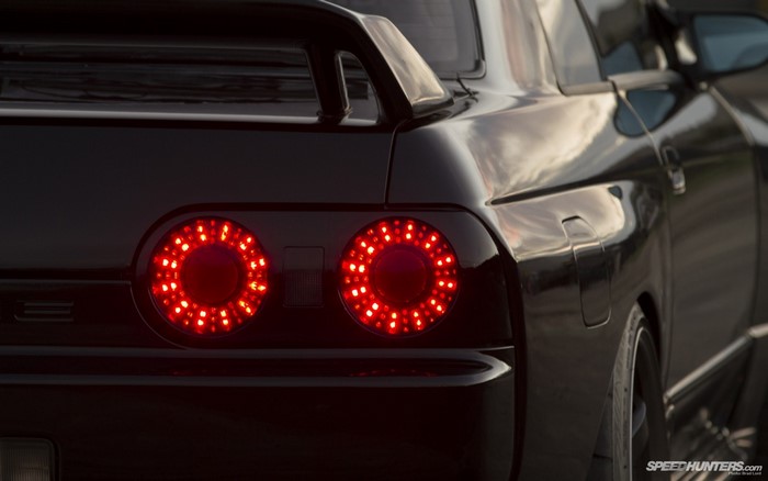 Black Nissan Skyline R32 with red taillights