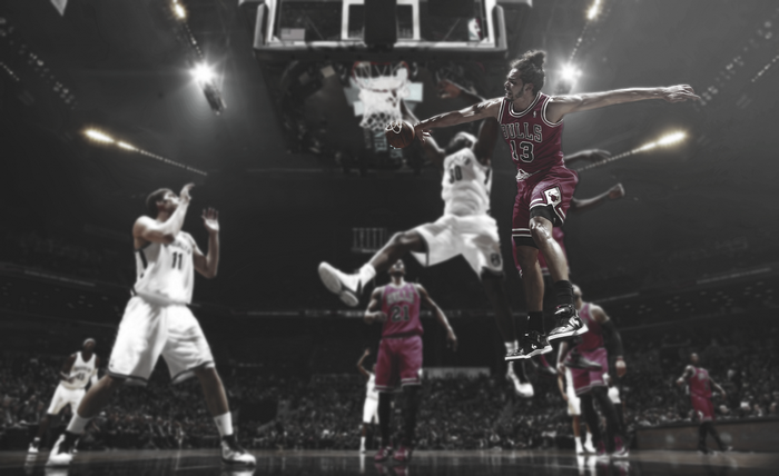 Basketball players in action during a game