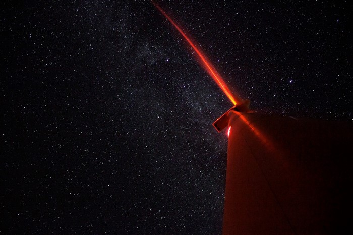 Telescope pointing at the Milky Way galaxy at night