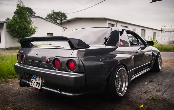 Nissan Skyline R32 GT-R parked on cobblestone