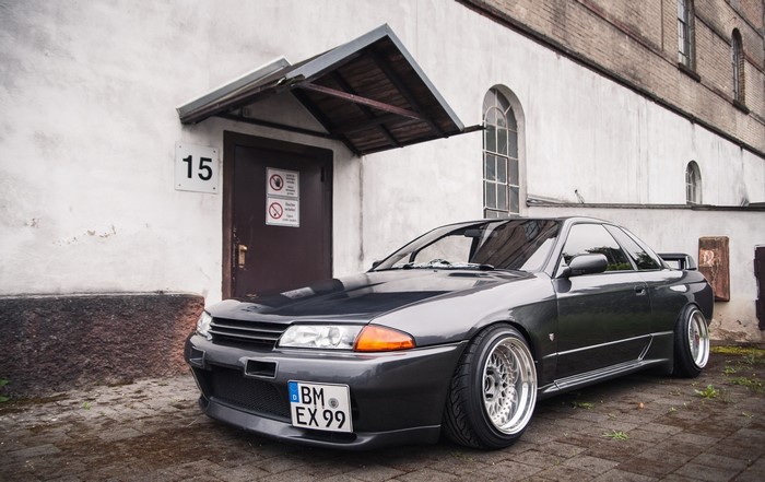 Nissan Skyline R32 GT-R parked in front of building