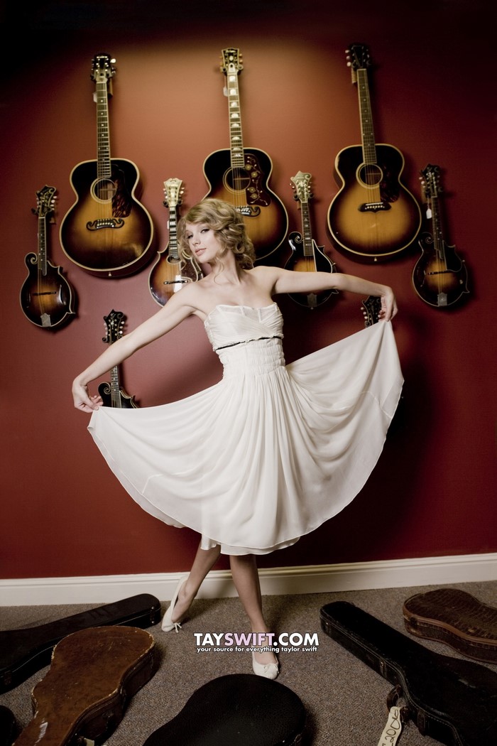 Taylor Swift with guitars and mandolins