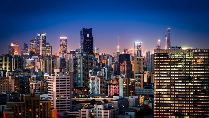 Shanghai cityscape at night with illuminated skyscrapers