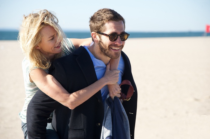 Naomi Watts and Jake Gyllenhaal on a beach