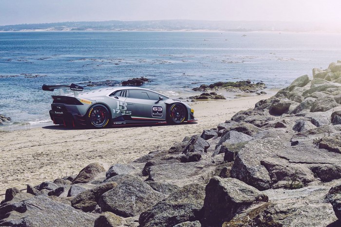Lamborghini sports car on a sandy beach by the ocean